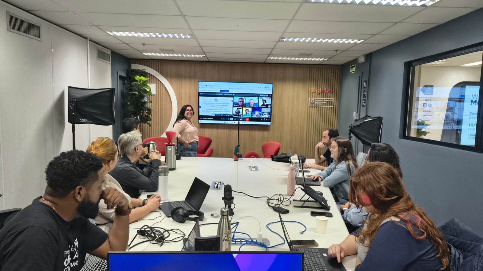 DBServices team during a strategy meeting, with colleagues joining remotely